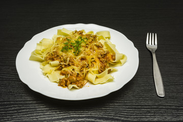 Lunch - Pasta with minced meat and grated yellow cheese.
