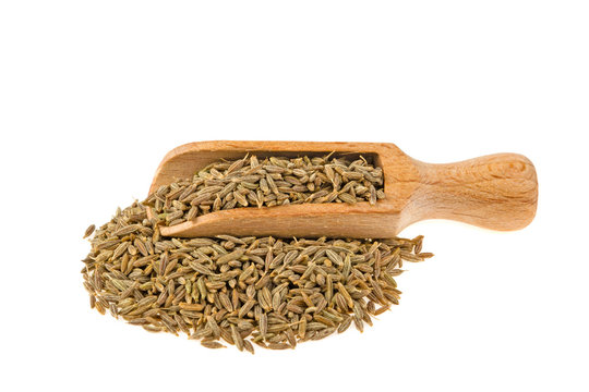 zira on a wooden spoon isolated on a white background