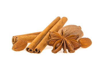 aniseed, cinnamon, almonds, nutmeg isolated on white background