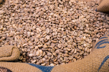 Unroasted coffe beans in sack