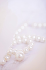 Pile of pearls on the white background