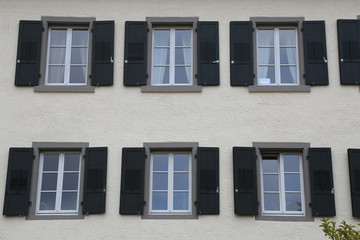 Fototapeta na wymiar Windows in a high-rise building