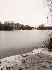 frozen over winter water surface lake december country outside landscape nature trees