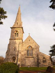 Fototapeta na wymiar full frontal view of old stone christian english church in mistley