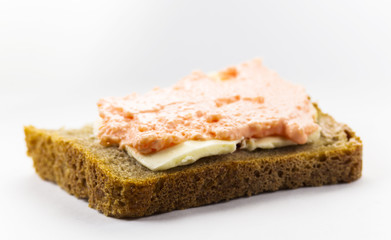 Sandwich of black bread, butter and caviar of capelin