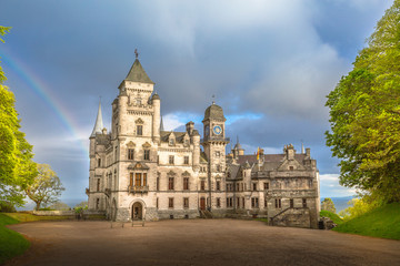 Fototapeta na wymiar Spectacular rainbow in the dramatic sky at the scenic Dunrobin Castle in Scotland. Northern Highlands in Golspie, the east coast of Scotland, United Kingdom.