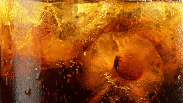 High quality video of cola with ice cubes in 4K