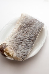 Slice of raw salted codfish