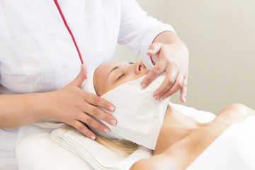 Process cosmetic mask of massage and facials in beauty salon