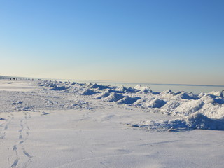 Fototapeta na wymiar Winter day at the seashore of Riga gulf, Baltic Sea, Jurmala, Latvia