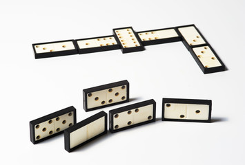 Chain of domino pieces on wnite background