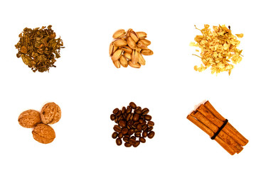 green tea, pistachio, jasmine tea, walnuts, coffee beans and cinnamon sticks isolated