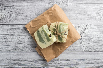 White-green handmade soap on a light background