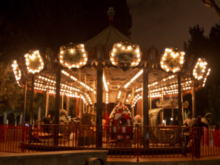 Fototapeta premium Fun fair and night . The beautiful light trails at night in a county carnival