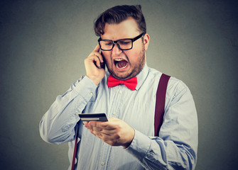 Angry man arguing on smartphone