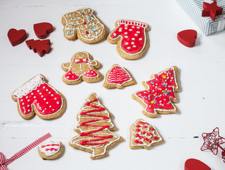 Christmas gingerbread cookies on white wood table
