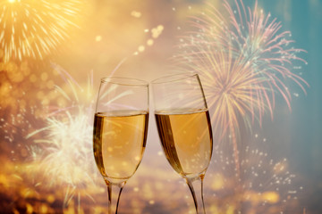 Champagne glasses on sparkling background