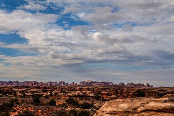 I captured this image on the Slickrock Trail in the Needles District of the Canyon Lands National Park in Utah. Signature Needles formations are in the distant background.