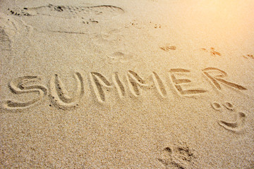 Summer inscription on the sand
