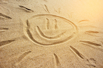 Drawing of the sun on the sand