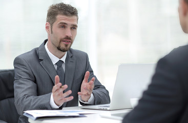 closeup.Manager and client discussing the terms of the contract in the office.