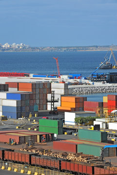 Container, lumber and train in port