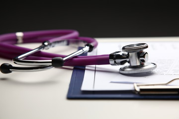 Closeup of a medical stethoscope with folder