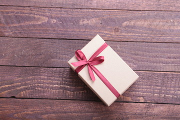 Gift boxes with bow on wood background