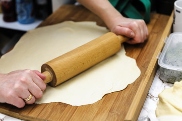 rolling the dough on dumplings