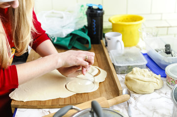 cutting dumplings out of the dough