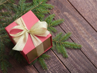 Fototapeta na wymiar Christmas fir tree with gift boxe on wooden board
