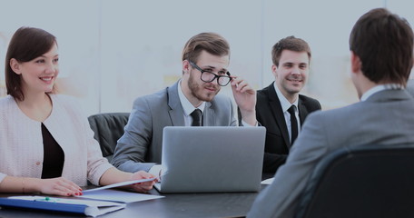 members of the management discuss the working problems of the co