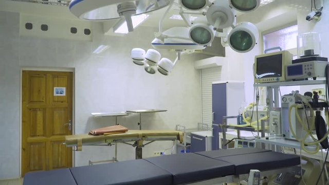 Operating room with equipment and medical devices in a veterinary clinic. Table for surgical operations in the hospital. Interior of operating room in modern clinic.