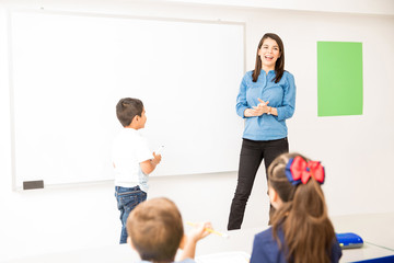 Preschool student participating in class