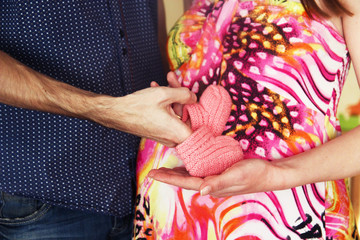 future mom and dad keep baby's booties