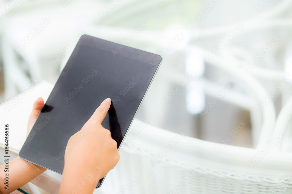 Poster closeup view of woman holding digital tablet on touch screen device working internet online or open 