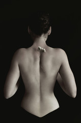 female back on black background