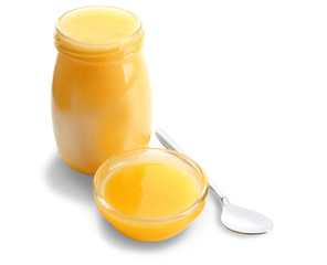 Bowl and jar with aromatic honey, isolated on white