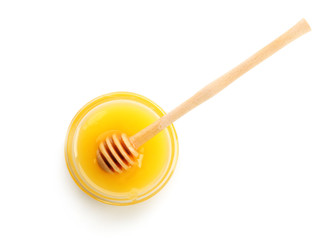 Bowl of aromatic honey with dipper, isolated on white