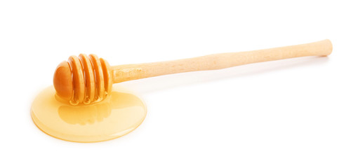 Dipper with honey, isolated on white