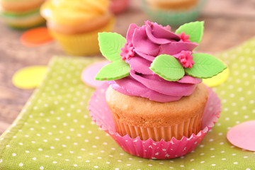Beautifully decorated cupcake on table, closeup