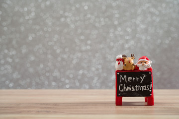 Christmas holiday background with Santa and decorations. Christmas landscape with gifts and snow. Merry christmas and happy new year greeting card with copy-space.