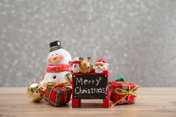 Christmas holiday background with Santa and decorations. Christmas landscape with gifts and snow. Merry christmas and happy new year greeting card with copy-space.