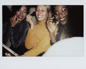 Diverse women in a backseat of a cab