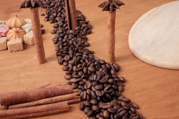 The original concept, coffee and sweets with spices. Place for your text.