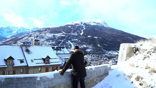 Man looking to old French city Briancon