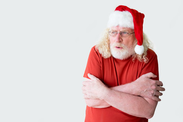 Santa Claus in t-shirt shivering with cold