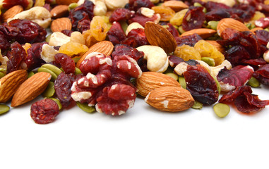Mix nuts, dry fruits and grapes on a white background