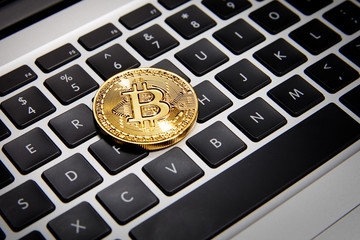 Bitcoin on laptop keyboard