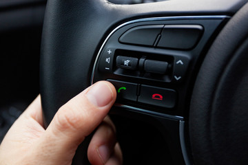 Buttons on the steering wheel for phone functions.